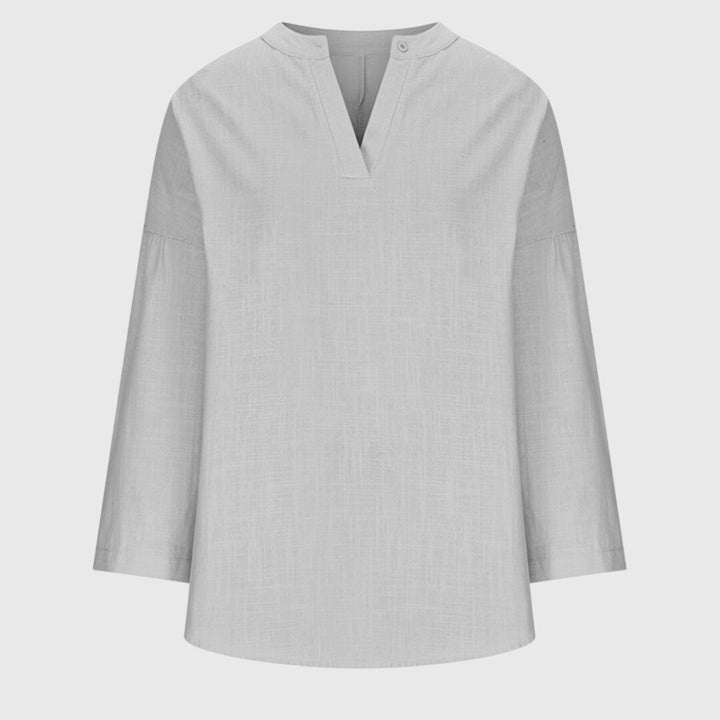 Camisa femenina sin mangas fluida con botones casual